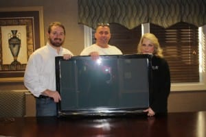 Jack Wingate & Mike Reese Of ALLCHOICE Give TV To Dixie Hull